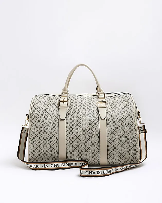 River Island Beige RI monogram travel bag< Bags, Purses & Luggage