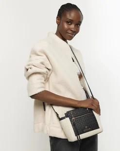 River Island canvas embossed RI cross body bag< Bags, Purses & Luggage