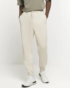 River Island Ecru regular fit rib panel joggers< Tracksuits