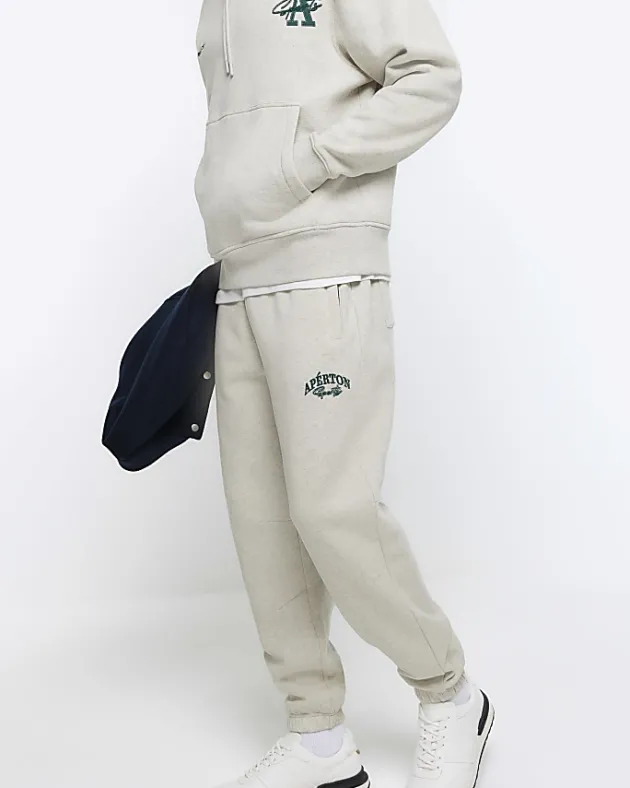 River Island regular fit graphic cuffed joggers< Tracksuits