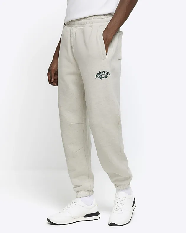 River Island regular fit graphic cuffed joggers< Tracksuits