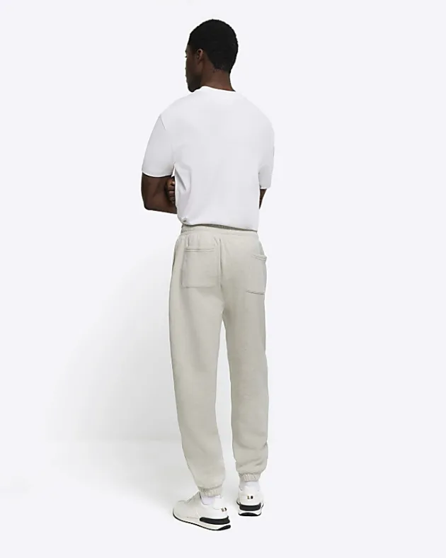 River Island regular fit graphic cuffed joggers< Tracksuits
